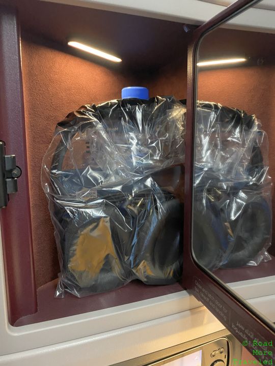 a plastic bag with headphones inside