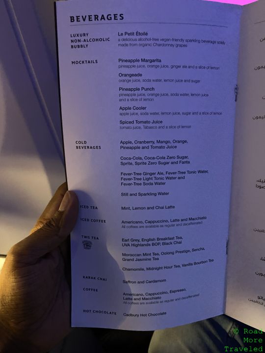 a hand holding a menu