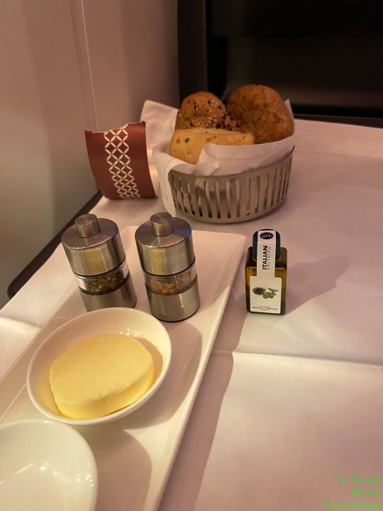 a tray with food and a bowl of butter on it