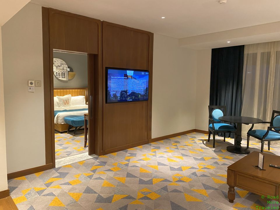 a room with a television and a bed