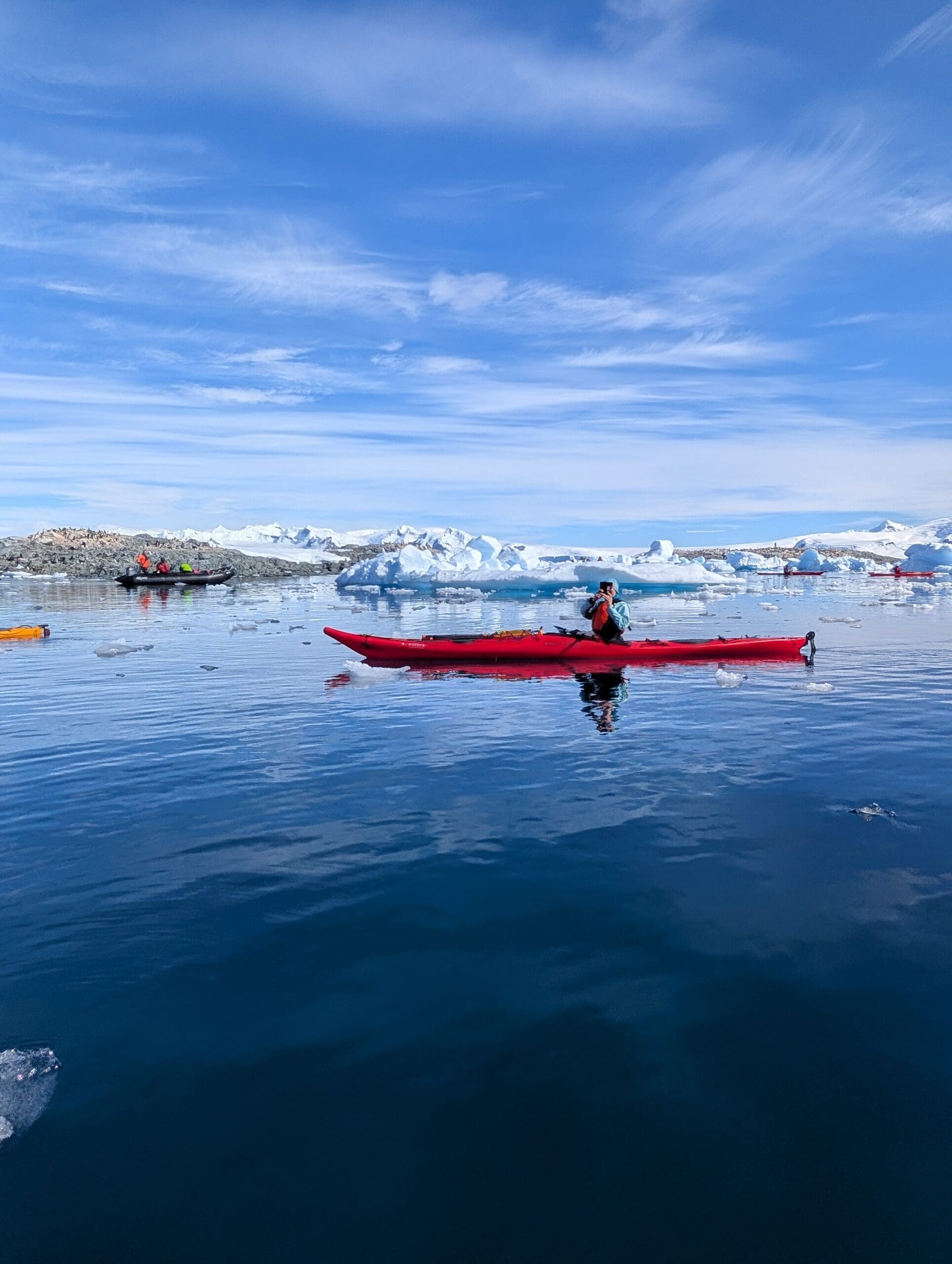 a group of people in a kayak on a body of water