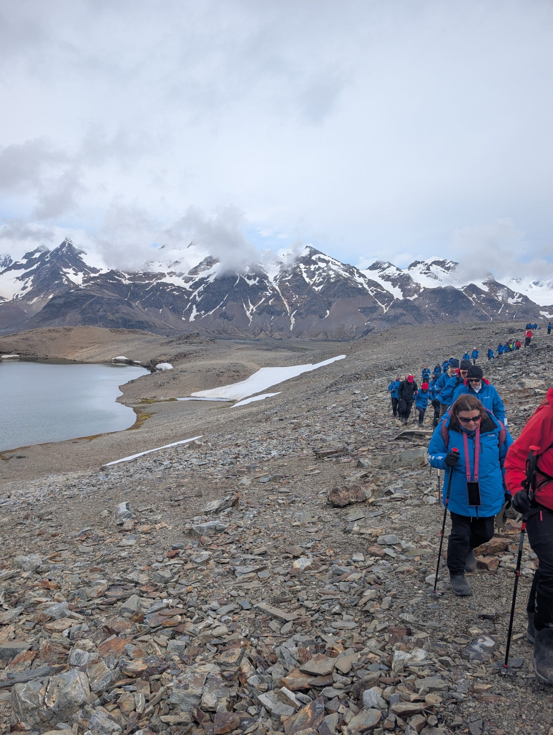 a group of people hiking on a rocky mountain