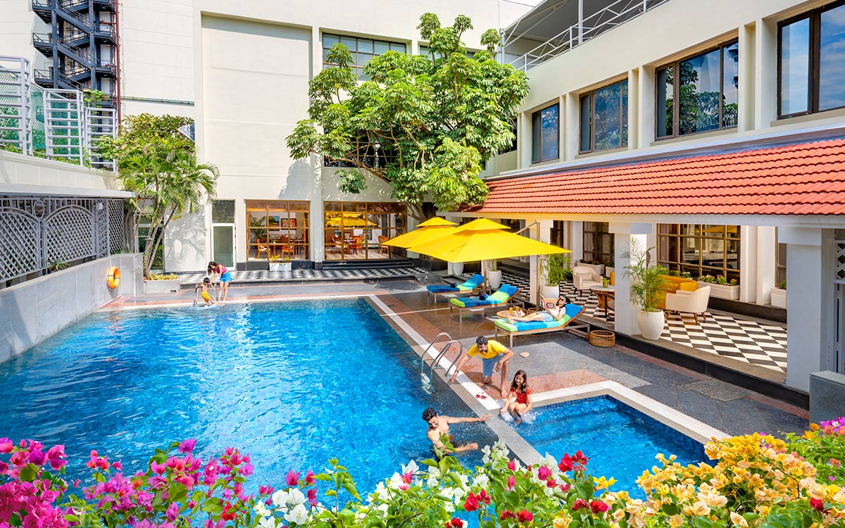 a group of people swimming in a pool